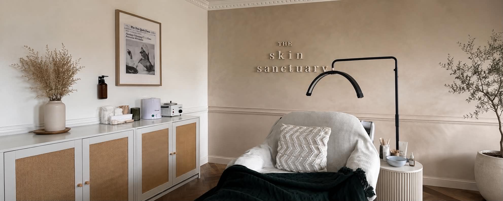 A softly lit beauty studio scene with relaxing treatment details